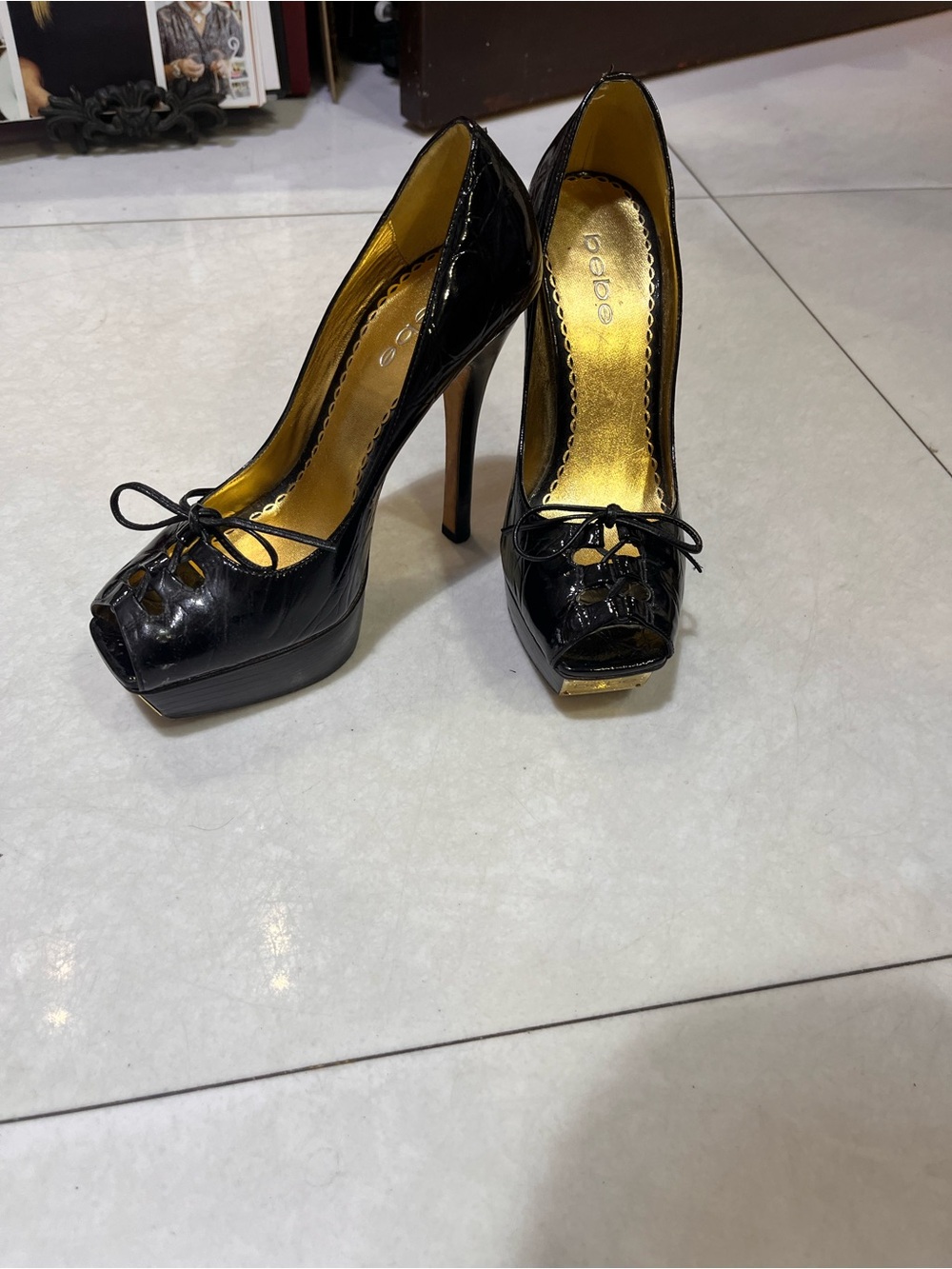 BEBE Black Patent Peep-Toe Stiletto Pumps with Gold Insole